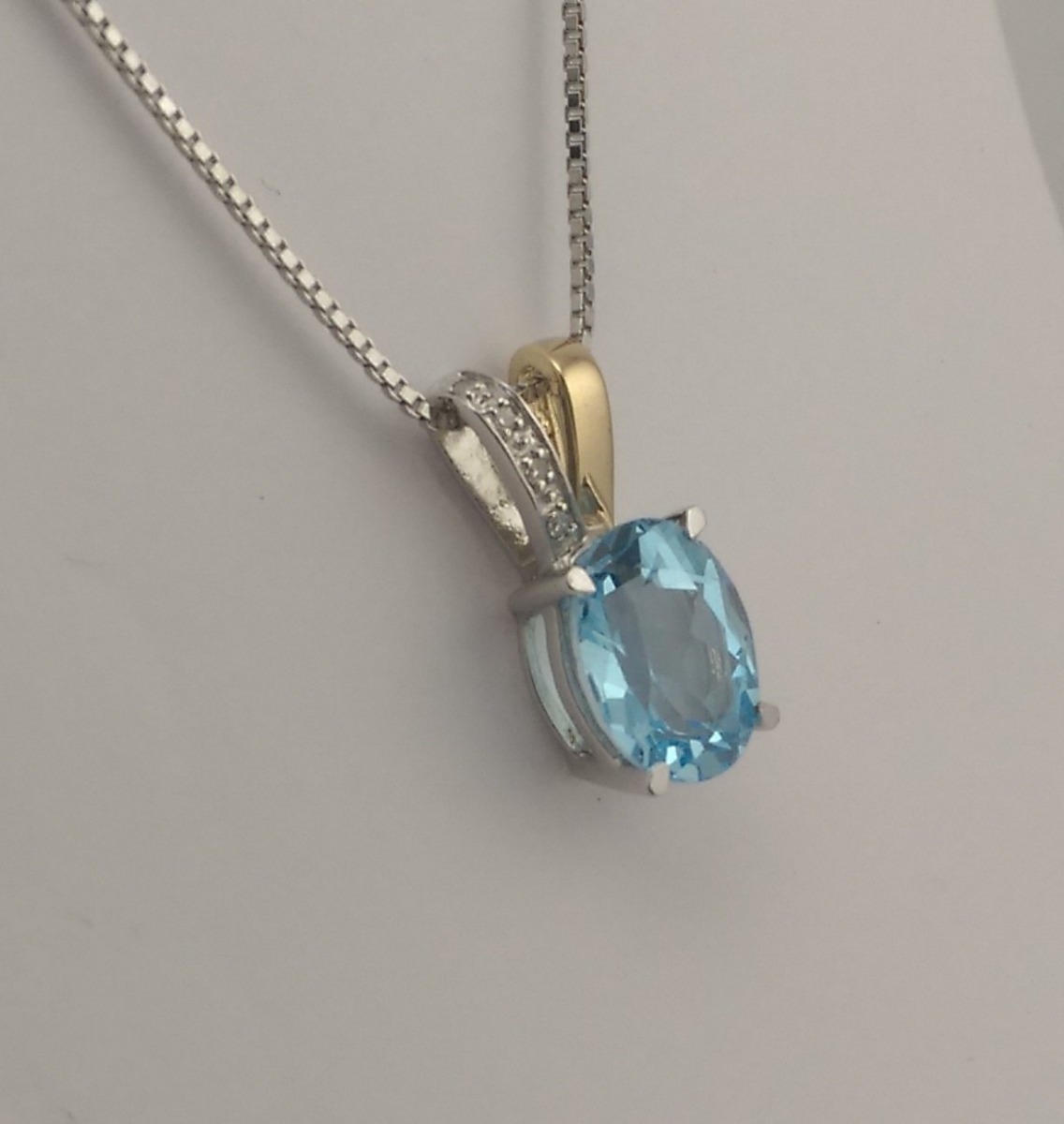 9ct White and Yellow Gold Blue Topaz and Diamond pendant and chain-0