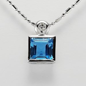 18ct White Gold Blue Topaz and Diamond Pendant on Chain-0