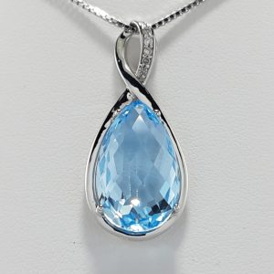 9ct White gold Blue Topaz and Diamond Pendant and chain-0