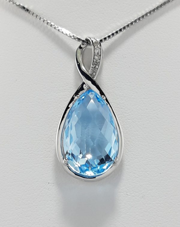 9ct White gold Blue Topaz and Diamond Pendant and chain-0